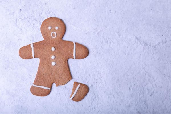A gingerbread man with a broken leg to represent Ways to Prevent Injuries This Holiday Season